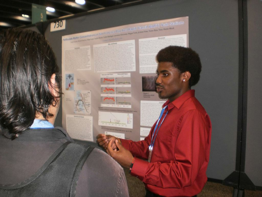A student presenting information at an event