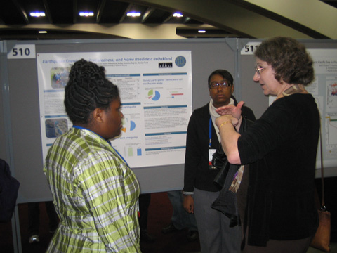 EBAYS students explain their findings as displayed on their poster at the American Geophysical Union (AGU) conference, December 2011