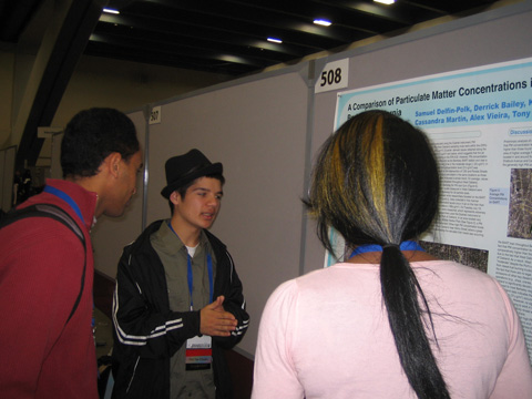 EBAYS students explain charted findings as shown on their poster at the American Geophysical Union (AGU) conference, December 2011