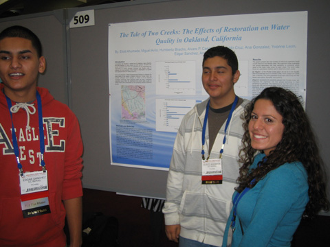EBAYS students explain charted findings as shown on their poster at the American Geophysical Union (AGU) conference, December 2011