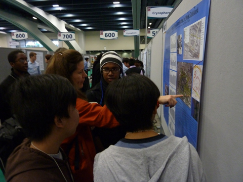 EBAYS students explain their findings as displayed on their poster at the American Geophysical Union (AGU) conference, December 2010